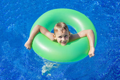 High angle portrait of boy in swimming pool