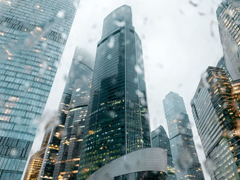 Modern buildings in city against sky