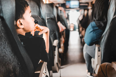 Boy traveling in bus