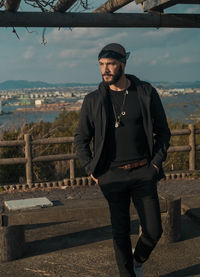 Portrait of young man standing outdoors