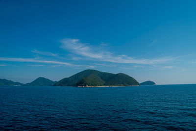 Scenic view of sea against blue sky