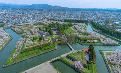 High angle view of river amidst buildings in city