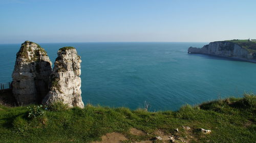 Scenic view of sea against clear blue sky