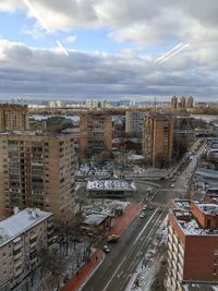 High angle view of city buildings against sky