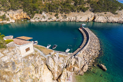 High angle view of sea against mountain