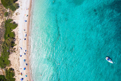 Aerial view of people enjoying on beach