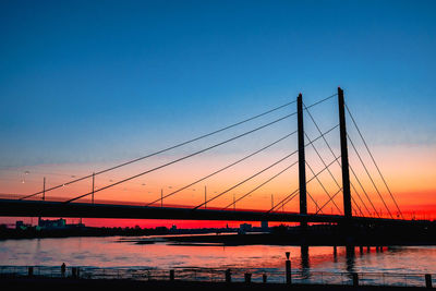 View of suspension bridge at sunset