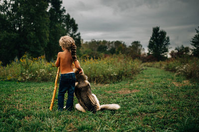 Full length of a dog on landscape