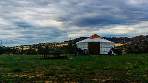 House on field against sky