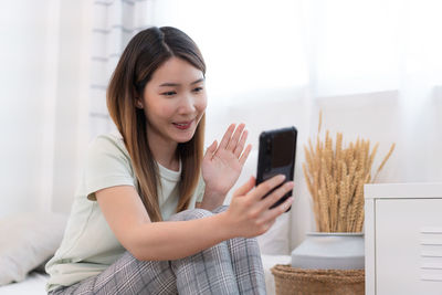 Young woman using mobile phone