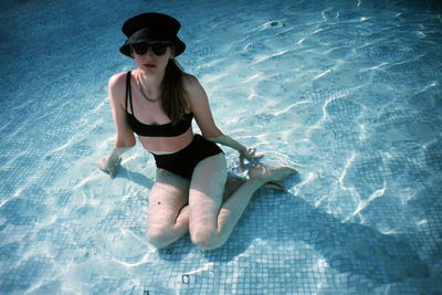 Young woman swimming in pool