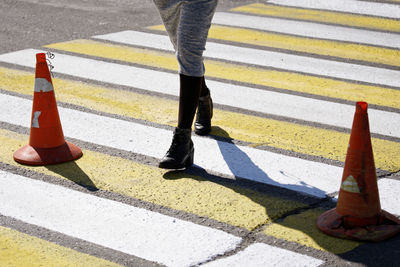 Low section of people walking on road