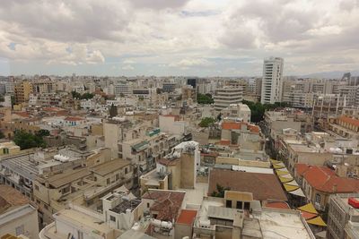 Aerial view of cityscape against sky