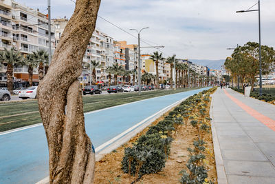 View of city by street against sky