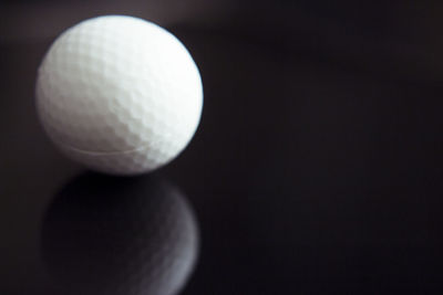 Close-up of ball against black background