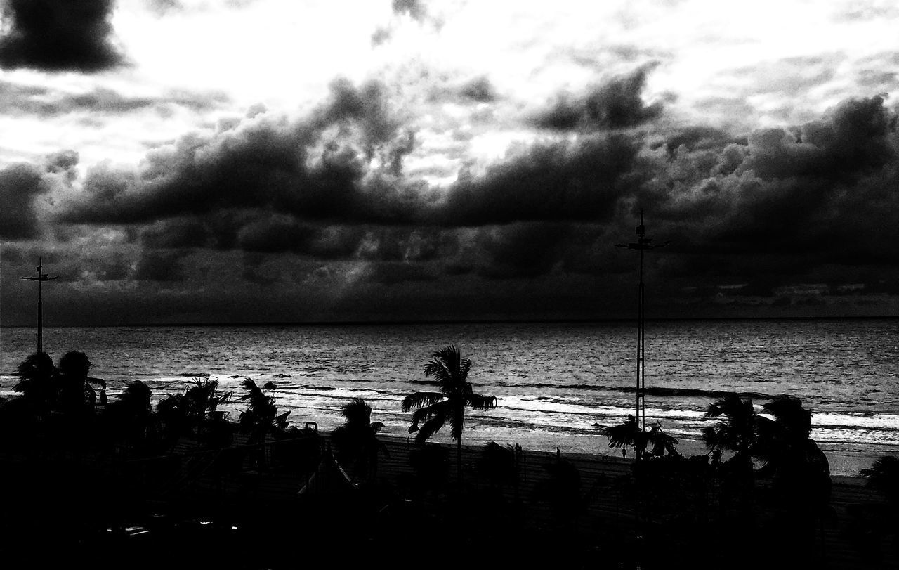 SILHOUETTE PEOPLE ON BEACH AGAINST SKY DURING SUNSET