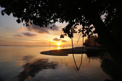 Scenic view of sunset over sea cove