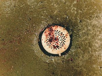 High angle view of manhole on beach