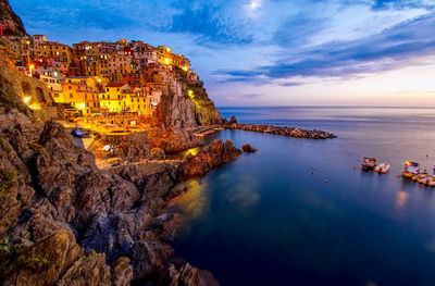 Panoramic view of sea and buildings against sky