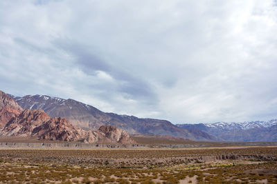 Scenic view of landscape and mountains against sky