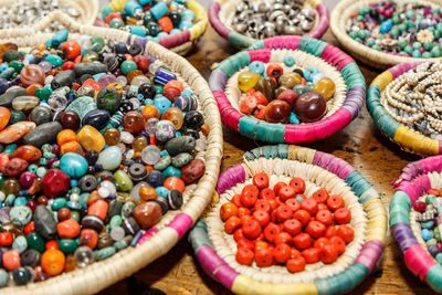  high angle view of baskets with colored stones