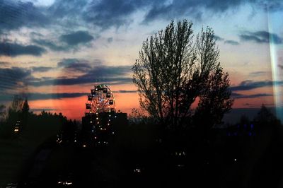 Silhouette trees against sky during sunset