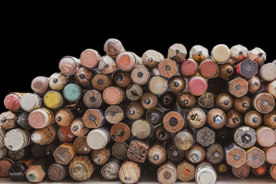 Used worn wooden pencils with eraser with black background