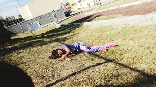 Full length of woman lying on bench