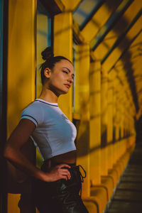 Side view of a young woman looking away