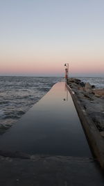 Scenic view of sea against clear sky during sunset