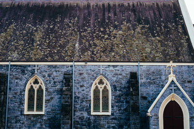 Low angle view of cross on building