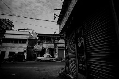 Street amidst buildings in city against sky