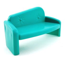 Close-up of blue chair against white background