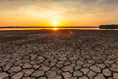 Traces of global warming. confronting the dried and cracked lake bottom. 