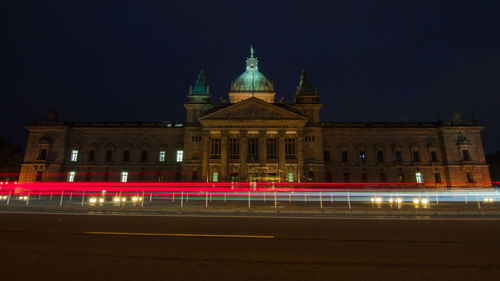 Light trails against sky at night