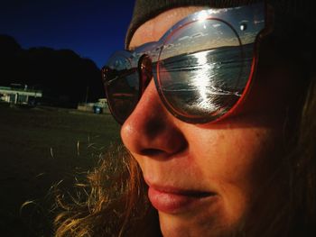 Close-up of young woman wearing sunglasses