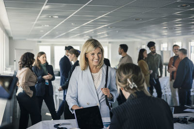 Woman picking up her pass before conference