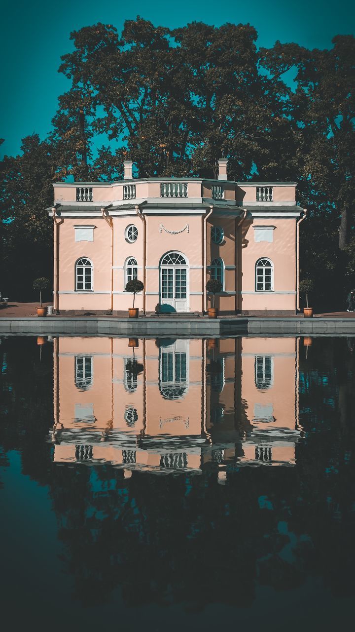 REFLECTION OF BUILDINGS ON LAKE