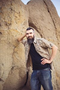 Young man standing on rock