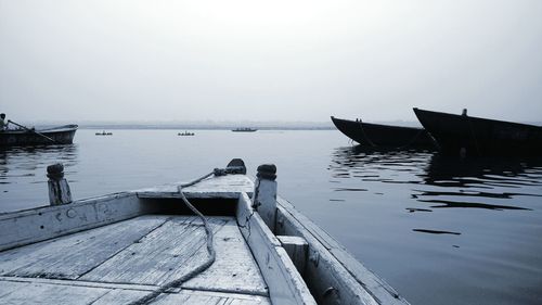 Boats moored on sea