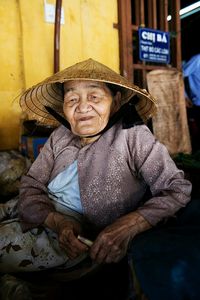 Portrait of senior woman sitting outdoors