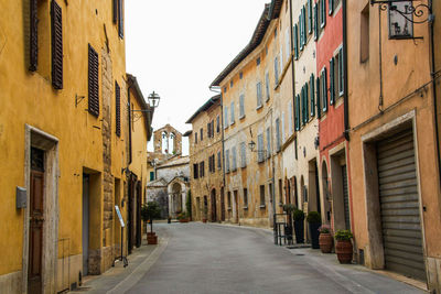 Empty alley amidst buildings in city