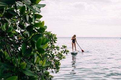 Reflection of woman in water