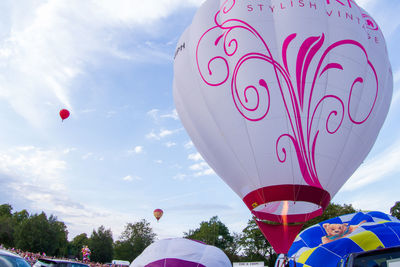 Low angle view of hot air balloons against sky