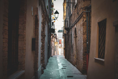 Rear view of man walking in tunnel