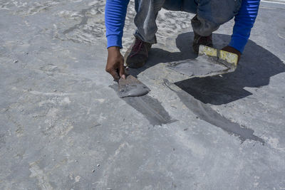 Low section of man working at construction site