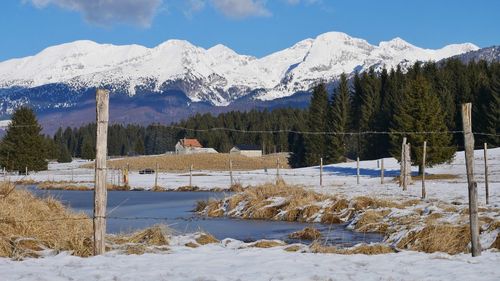 Scenic view of snowcapped mountains against sky