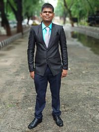 Portrait of young man standing outdoors