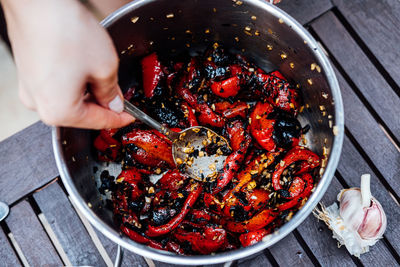 Grilled red bell pepper on plate. grill baked vegetable pepper with garlic sauce in a saucepan