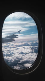 Scenic view of cloudscape seen through airplane window